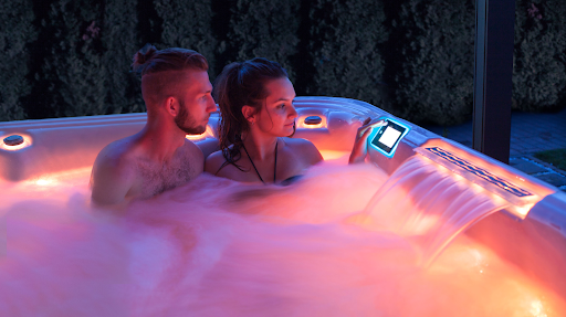 couple in their well insulated wellis hot tub