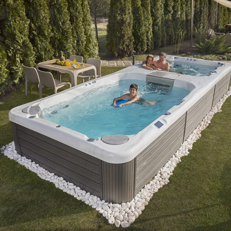 A Wellis swim spa nestled in a well-kept yard provides the perfect recreational environment for the whole family.