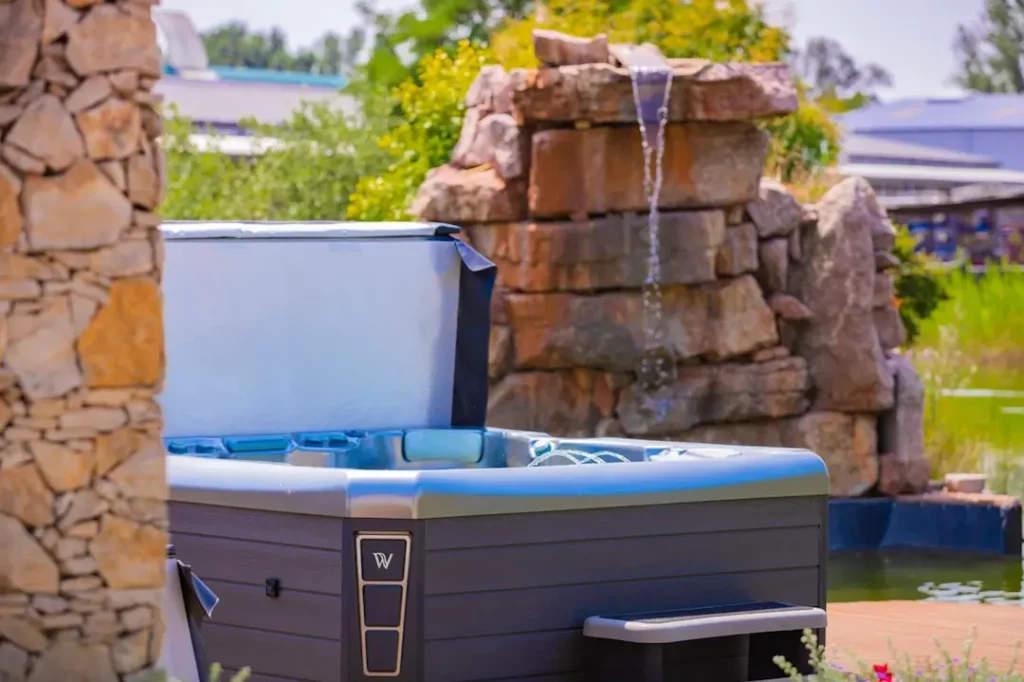 Trending Patio Ideas for 2024 5 Picture of a family soaking in a hot tub after reading, "Are hot tubs good for you," article.