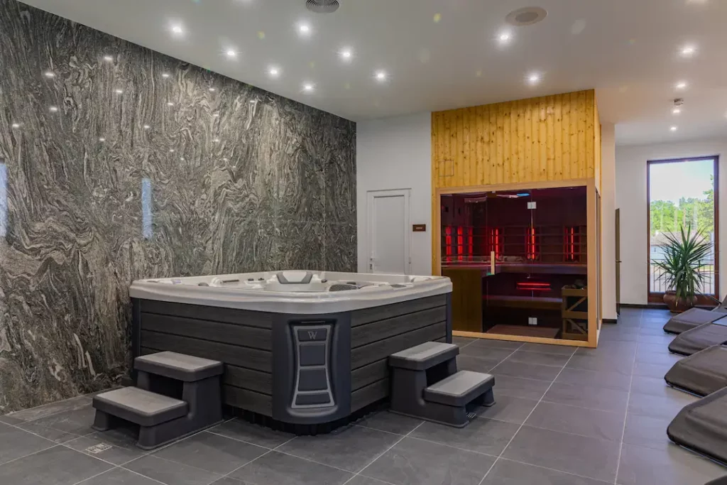 Things to Consider Before Installing an Indoor Hot Tub 1 Picture of an indoor hot tub.