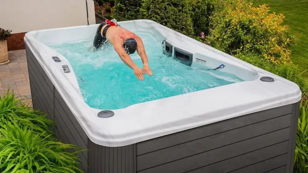 Best Swim Spa Workout Routines 1 Person using a swim spa resistance band for their swim spa workout.