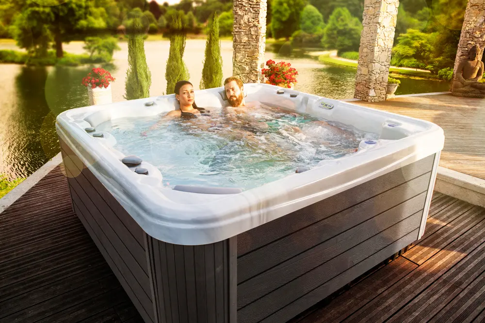 The Best Plug and Play Hot Tubs 1 Image of a couple soaking in the Orion P&P, one of the best plug and play hot tubs by Wellis.