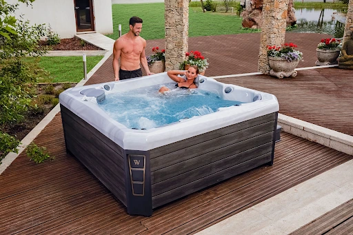 Wellis Spas Online Reviews 1 man and woman enjoy their spa in online reviews