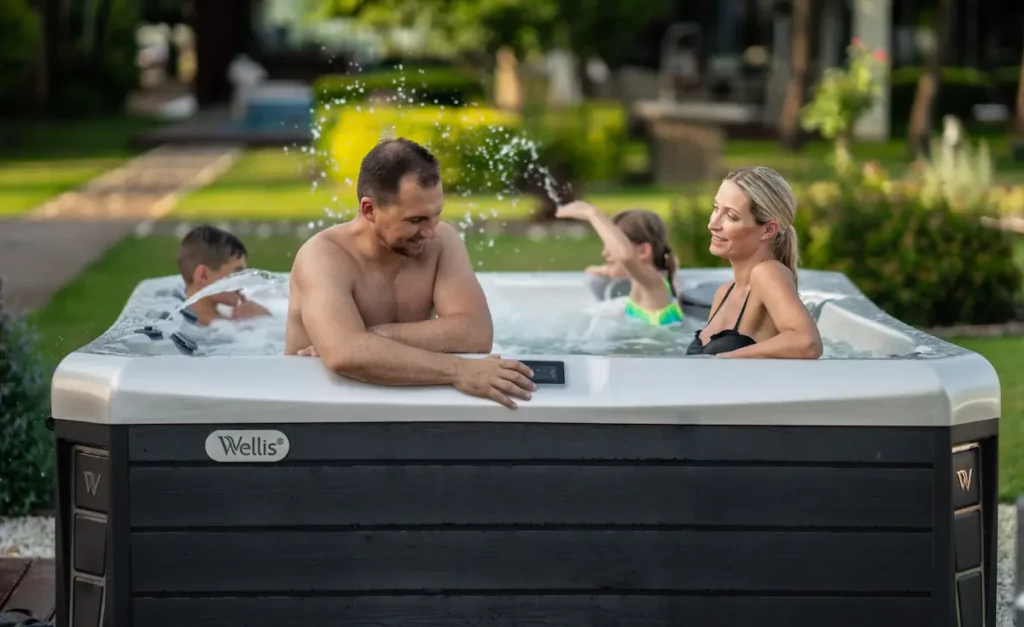 Picture of a family in a hot tub for the article about the best family hot tubs for sale.