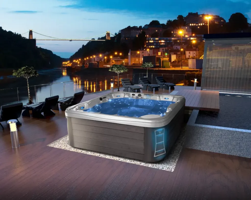 A hot tub sitting on a deck for the article about trending patio ideas.