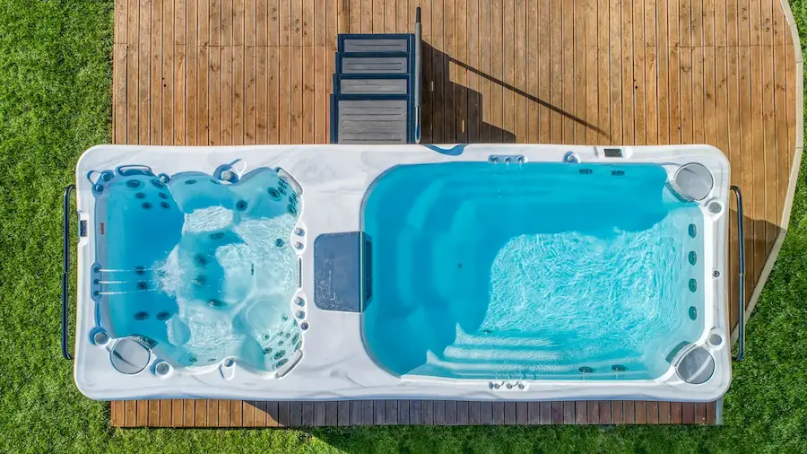 Aerial view of a Wellis swim spa shown with swim spa accessories.