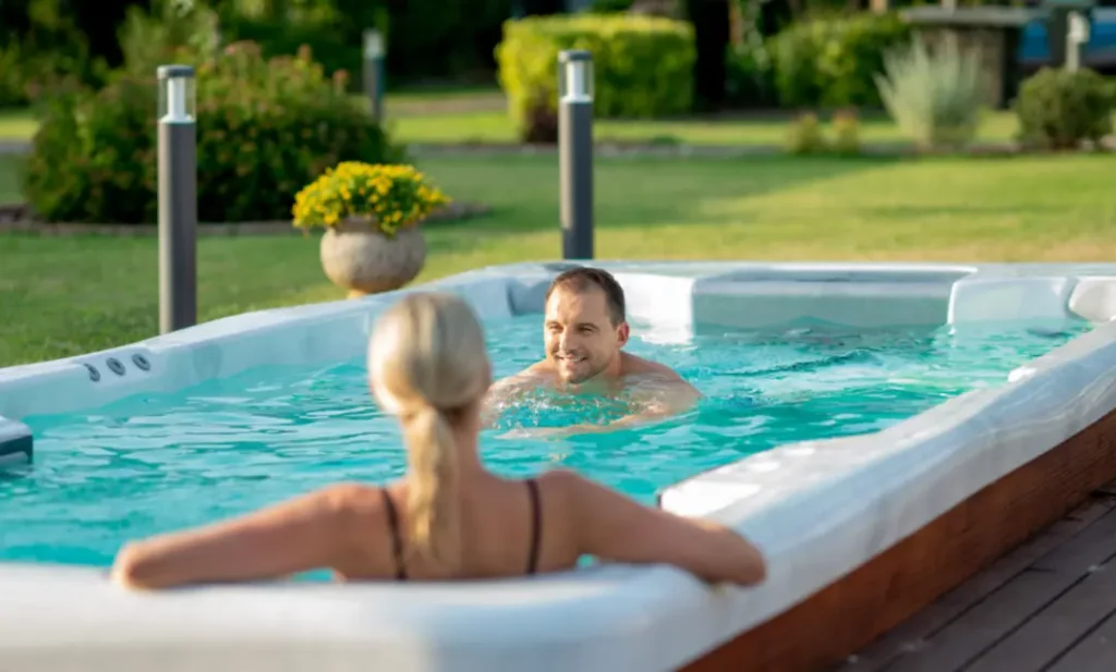 Picture of a couple swimming in a swim spa after learning about the best home workout ideas.