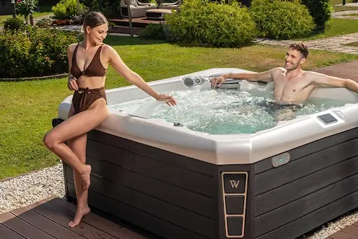 a couple enjoying the benefits of hot tubs
