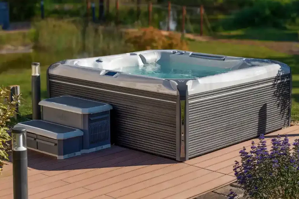 An Wellis Spa hot tub placed on a wooden deck, encouraging readers to opt for a new purchase rather than used hot tubs for sale