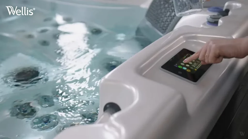 Person pressing a button on their luxury hot tub to sync with Bluetooth.